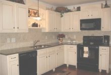 Cream Cabinets With Black Appliances