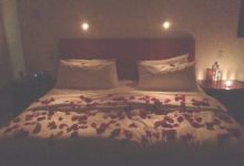 Rose Petals And Candles In Bedroom