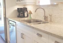 Kashmir Gold Granite With White Cabinets