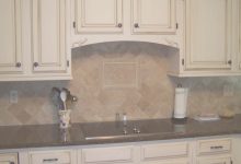 Cream Colored Cabinets With Brown Glaze