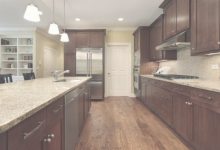 Santa Cecilia Light Granite With Dark Cabinets