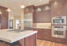 Cherry Cabinets With White Countertops