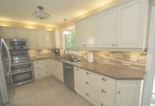 Cream Kitchen Cabinets With Stainless Steel Appliances