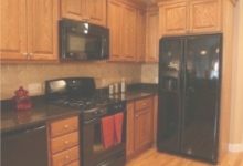 Black Appliances With Oak Cabinets