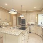 Santa Cecilia Light Granite With White Cabinets